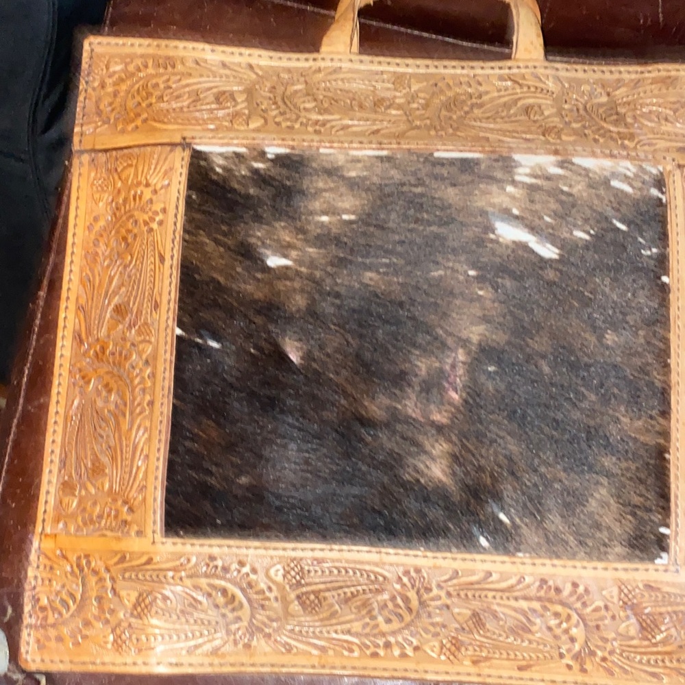 ELeather and Cowhide cushion. $24 each or both for $40.